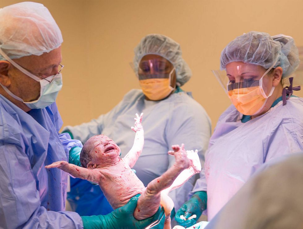 the viral photo of this moms 4 day labor doesnt tell the whole story 0 Motherly